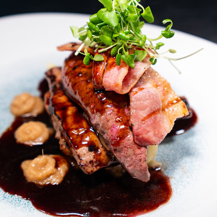 Duck breast with pancetta and a red wine jus, plated at Ennios