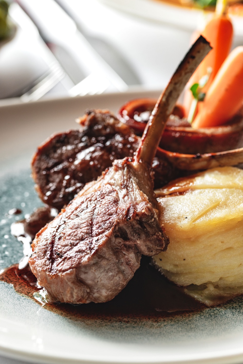 Rack of lamb with dauphinoise potatoes and red wine jus at Ennios